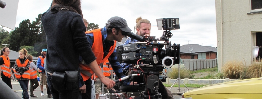 Rob Sarkies looking through a camera on set