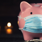Piggy bank wearing a surgical mask